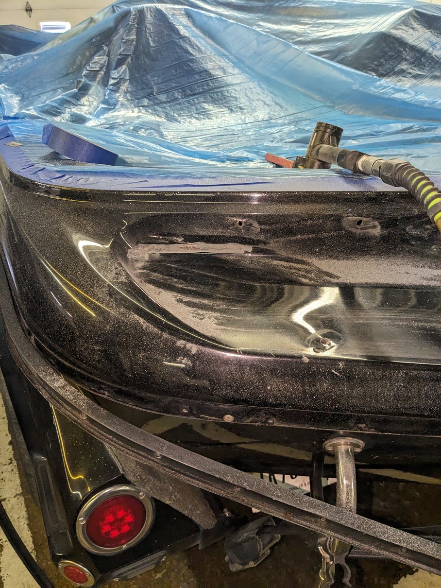 a close up of the fiberglass damage on a speed boat in culver indiana